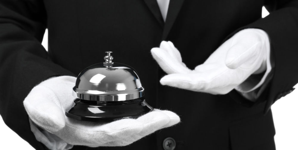 Man holding bell on white background, closeup